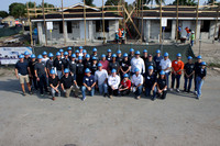 South Florida CEOs proudly pose for a quick snap in front of new Habitat homes they helped roof during Habitat Broward’s 4th annual CEO Build at “A Rick Case Habitat Community” in Pompano Beach.